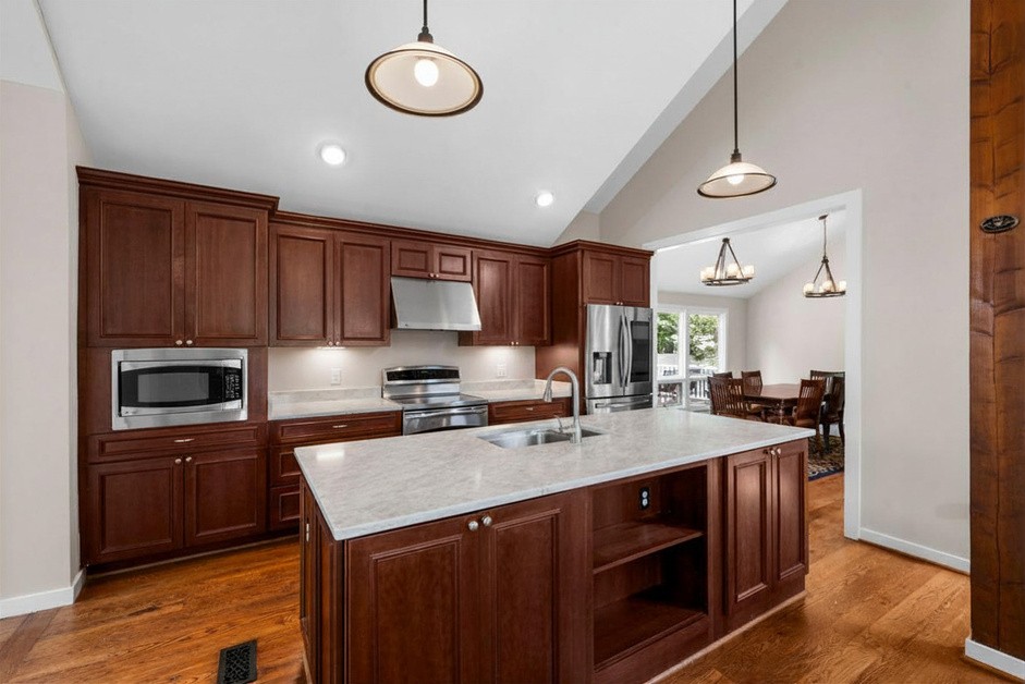 Gourmet kitchen with granite counters and a large island
