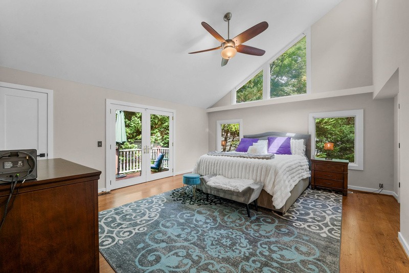 Main level owner&rsquo;s suite with a private deck